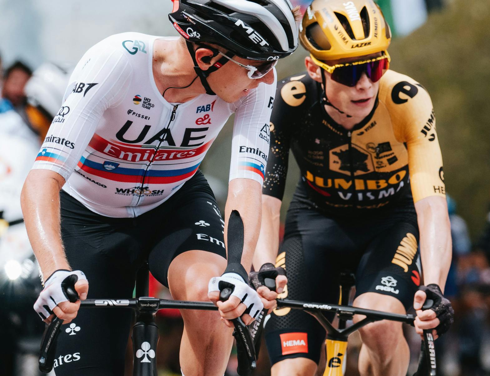 Jonas Vingegaard and Tadej Pogacar riding next to each other at the Tour de France.