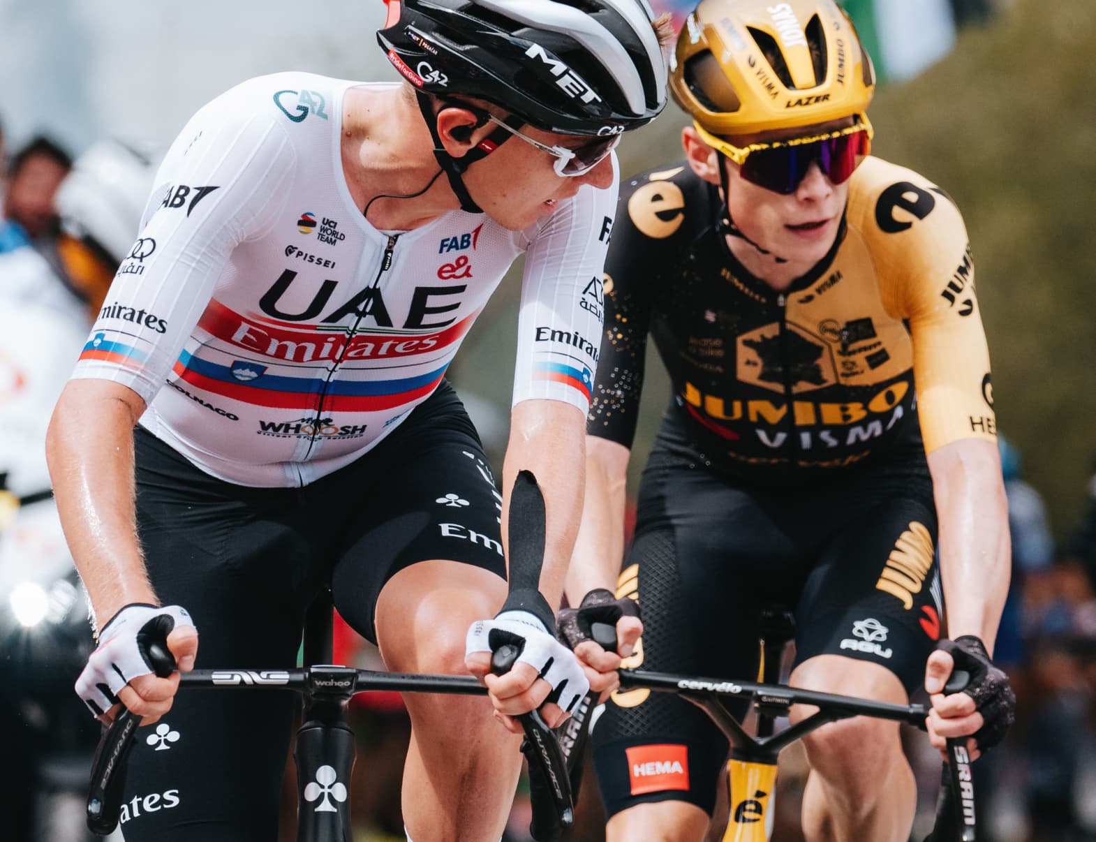 Jonas Vingegaard and Tadej Pogacar riding next to each other at the Tour de France.